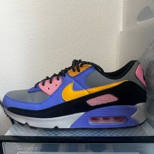 Nike Air Max 90 "Viotech". bright purple, pink, yellow, and blue panels.